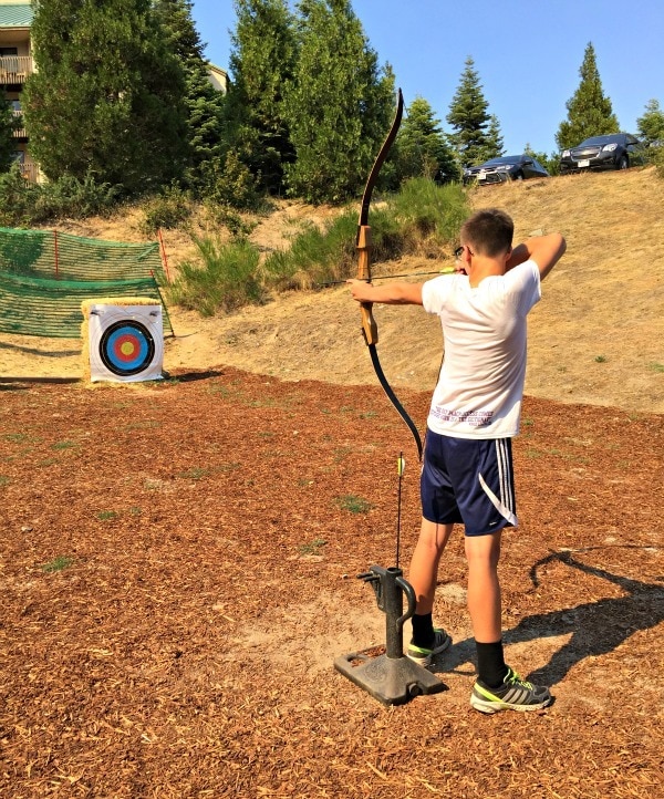 Taking aim during a family archery lesson at Tenaya Lodge in Yosemite National Park