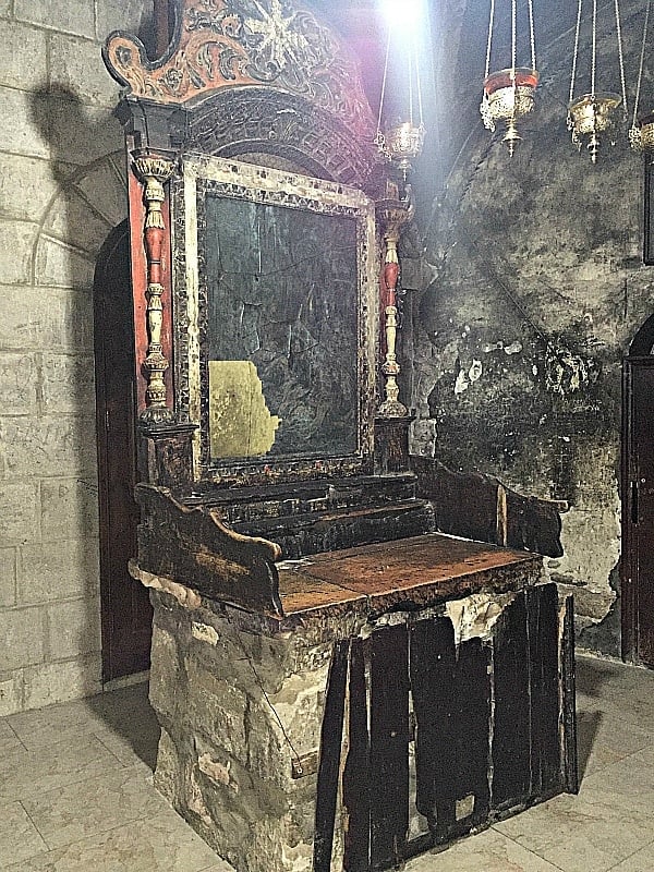 A small, curved stairway to the crypt that contains the bones of Jesus can be found in this unmarked chapel, which was damaged by fire, at the Church of the Holy Sepulchre 
