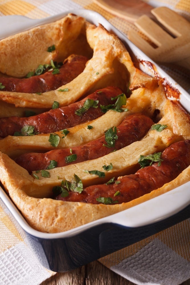 Toad in the Hole is a British dish with a funny name. It's made with pork sausages baked in batter.