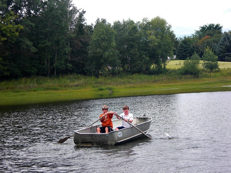 A home exchange comes with perks...like this backyard lake and row boat!