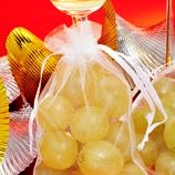 At midnight, revelers eat 12 grapes at the stroke of midnight in Spain for good luck in the New Year