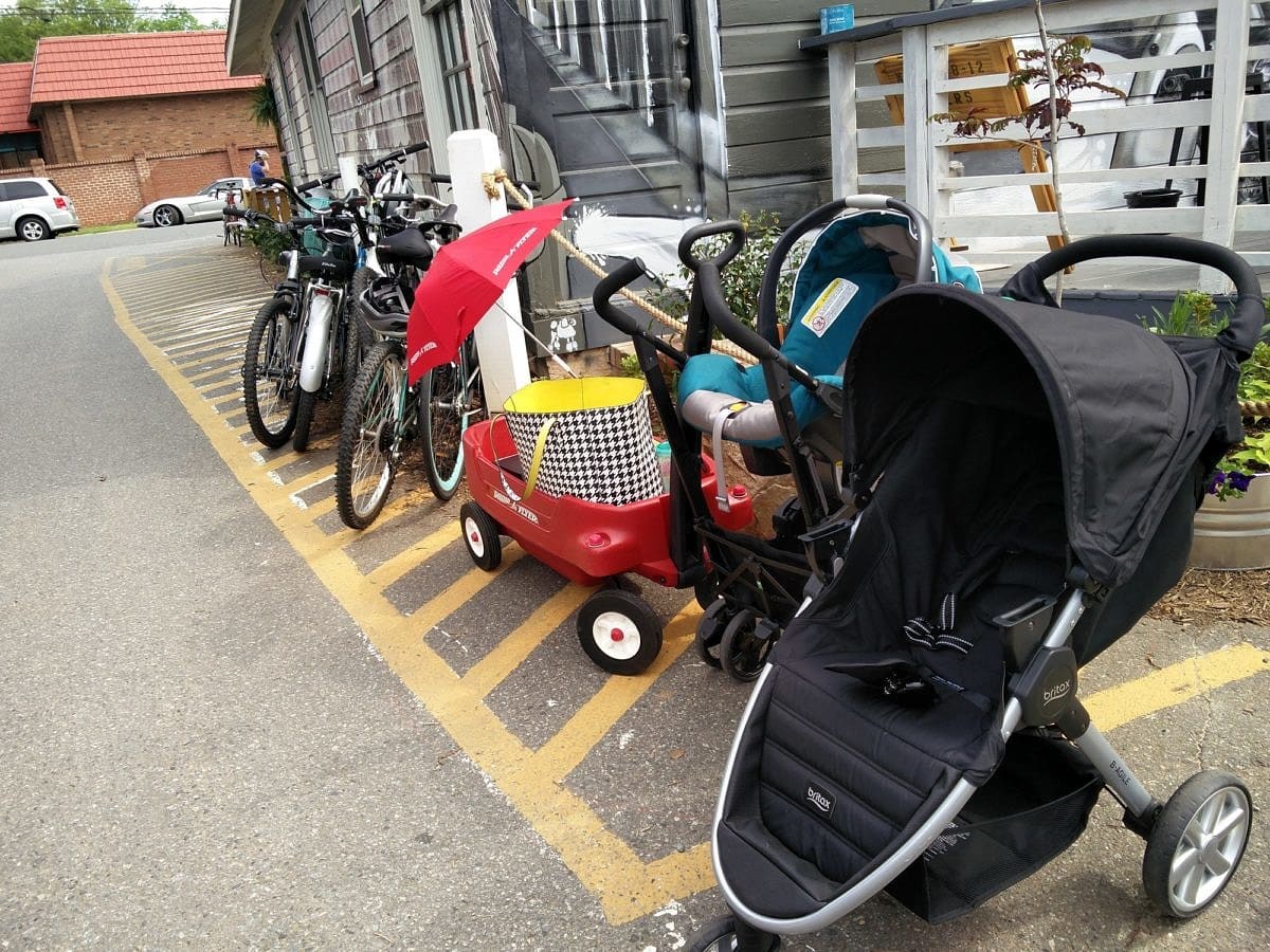 Strollers parked outside a brewery in Charlotte ~ 10 Tips for Visiting a Brewery with Kids