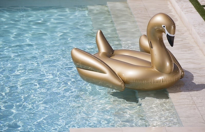 Add a little glitz to your summer with a gold swan pool float ~ Best Pool Floats