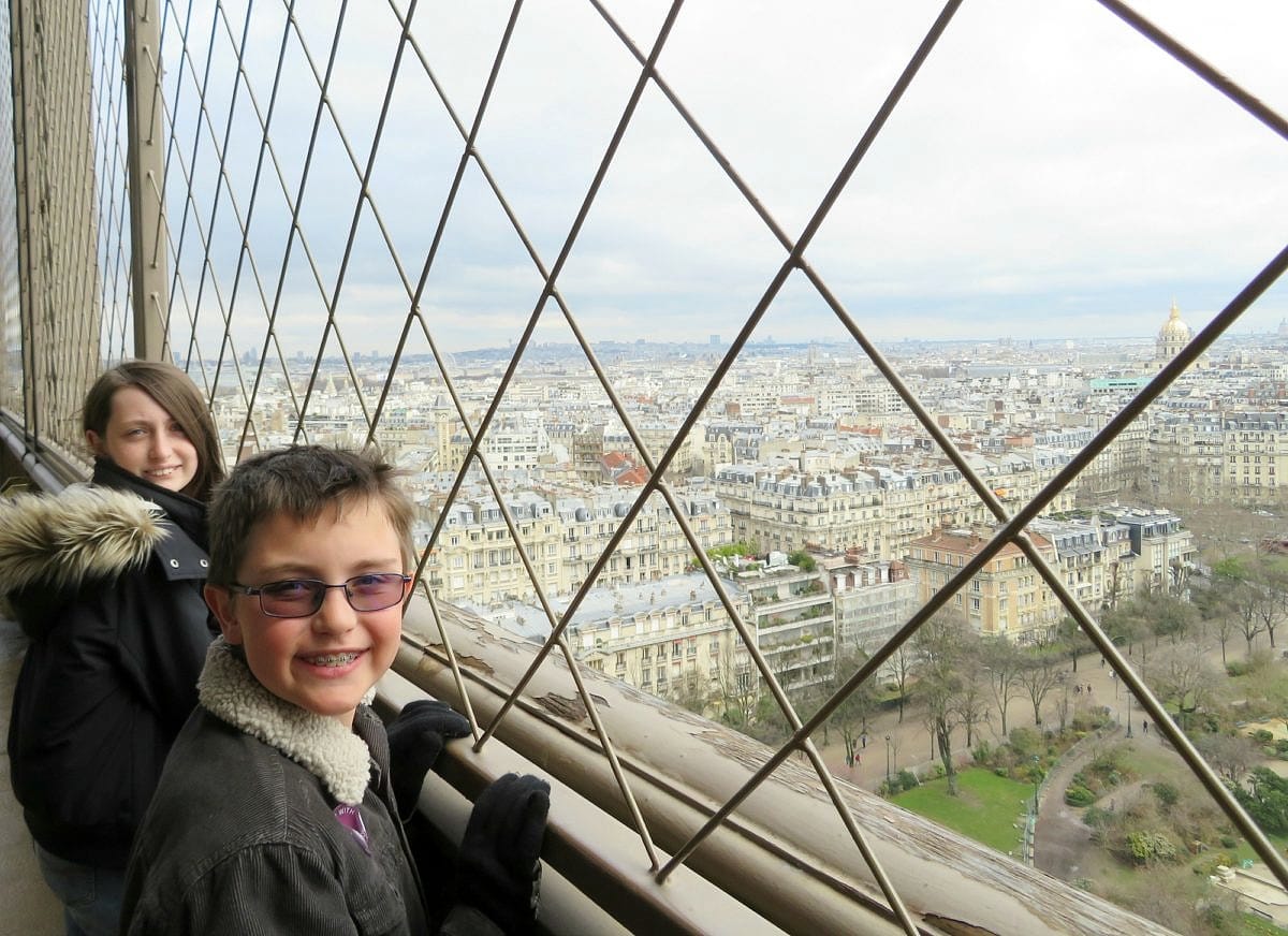 View of Paris from the second level of the Eiffel Tower in Paris with kids