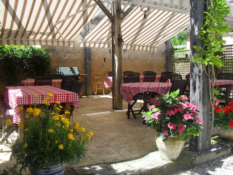 Tables in the garden at Le Chèvrefeuille