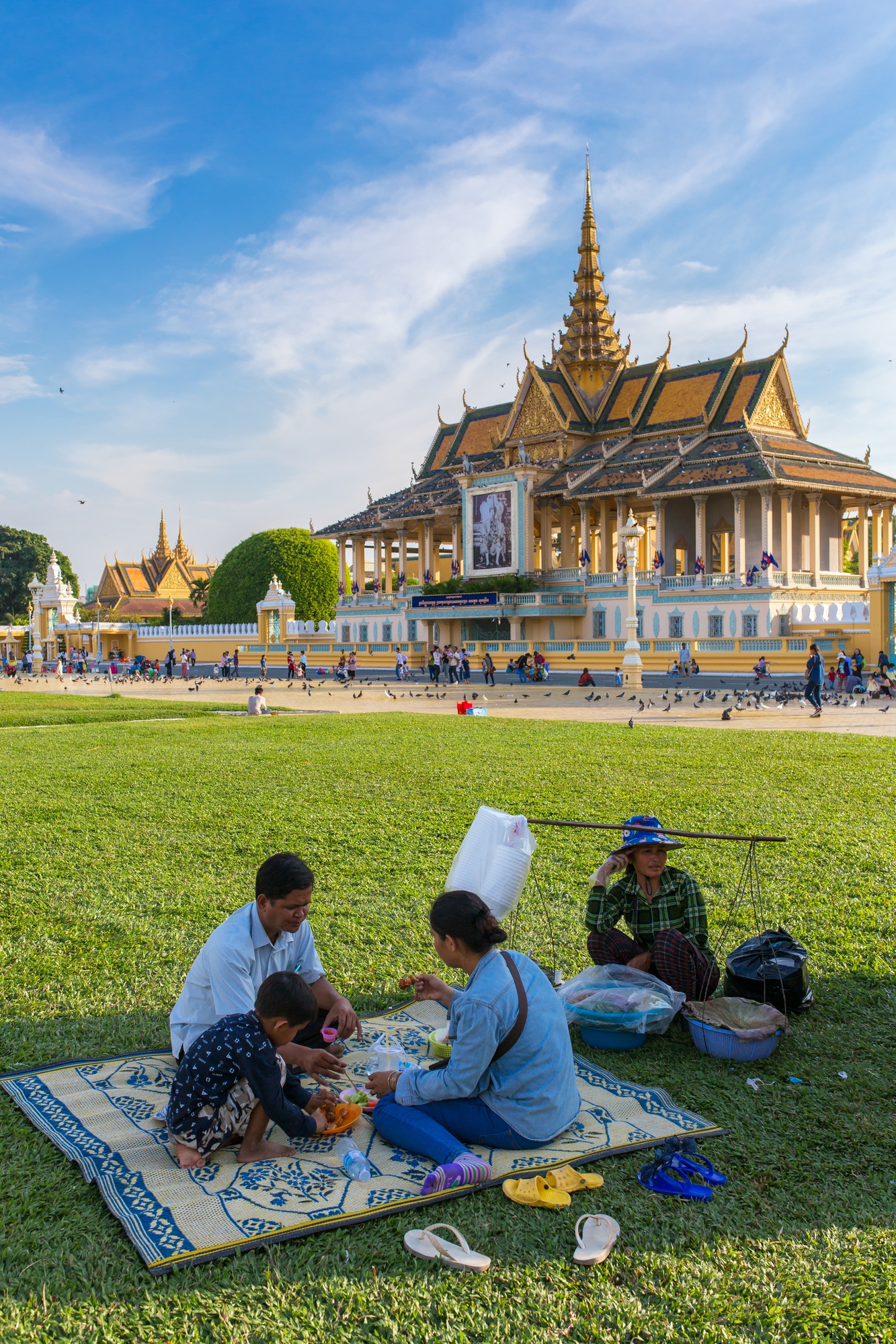 A family picnic on the ground of the Royal Palace in Phnom Penh, Cambodia