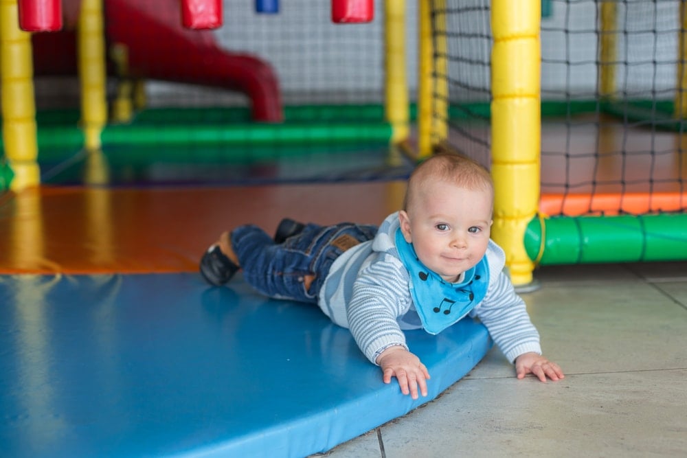 Toddler playing in airport playground