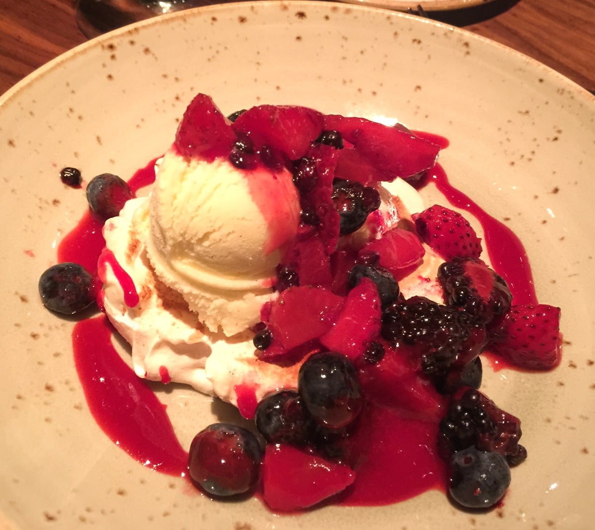 Pavlova topped with ice cream and fresh berries at Mountain Standard at Vail Ski Resort