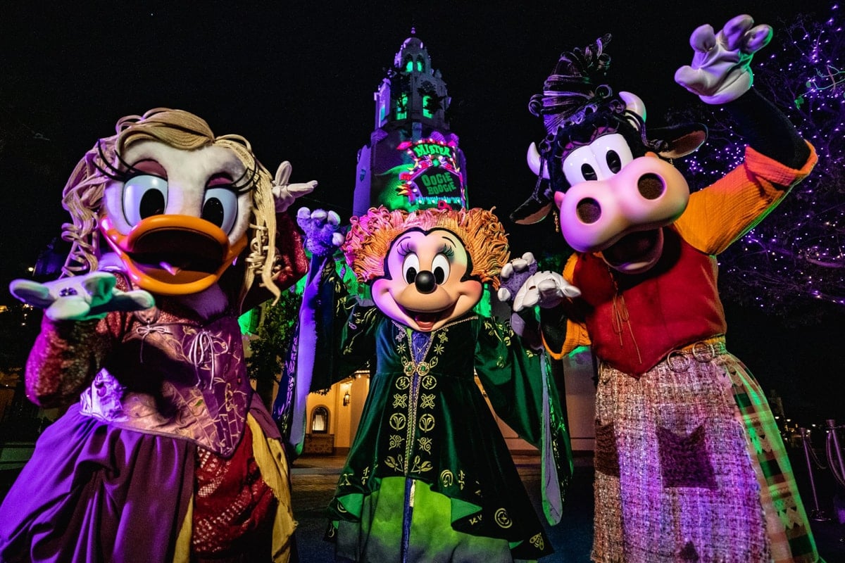 Minnie Mouse, Daisy Duck and Clarabelle Cow  dressed as the Sanderson Sisters from Disney’s “Hocus Pocus” during Oogie Boogie Bash