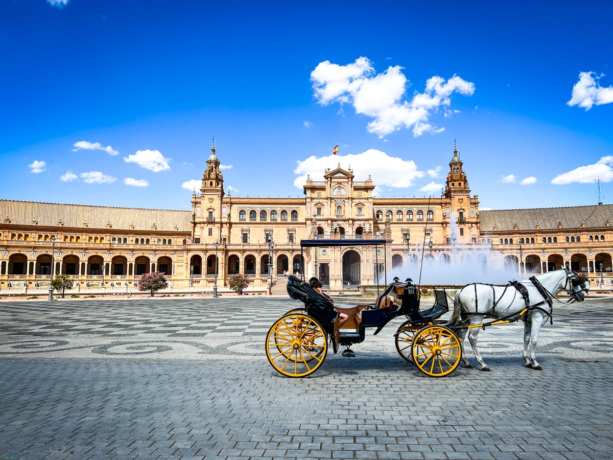 Horse drawn carriage rides in Plaza de España with kids