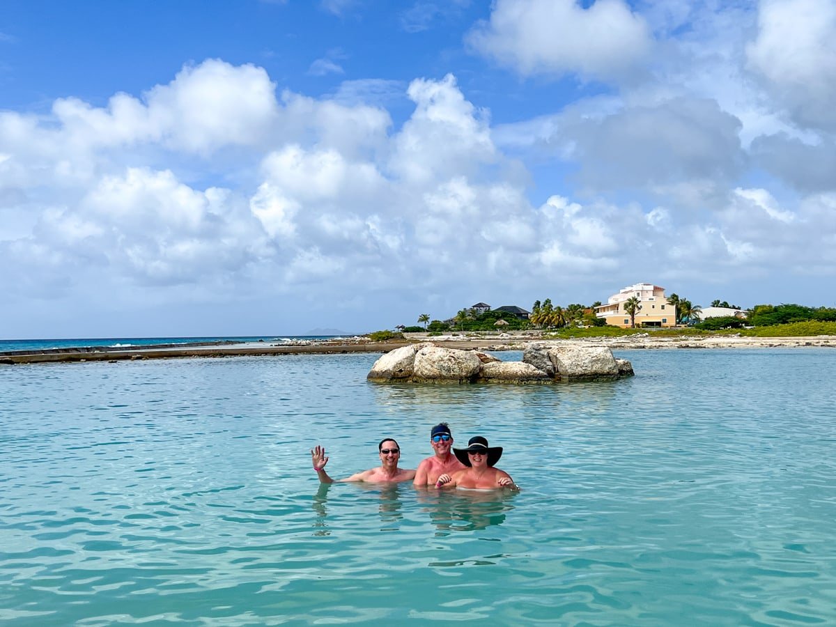 Friends swimming in a lagoon during shore excursion