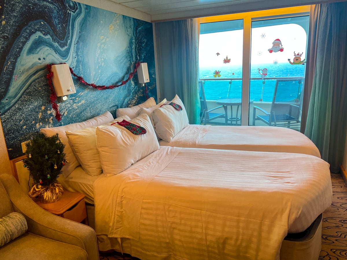 Royal Caribbean twin beds in stateroom decorated for Christmas