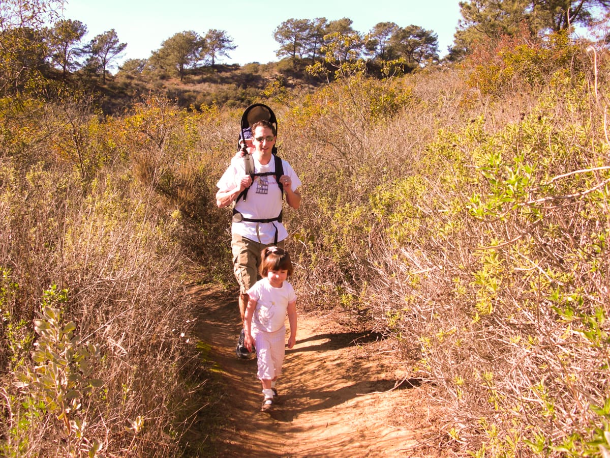 Dad and young kids hiking in Julian, California