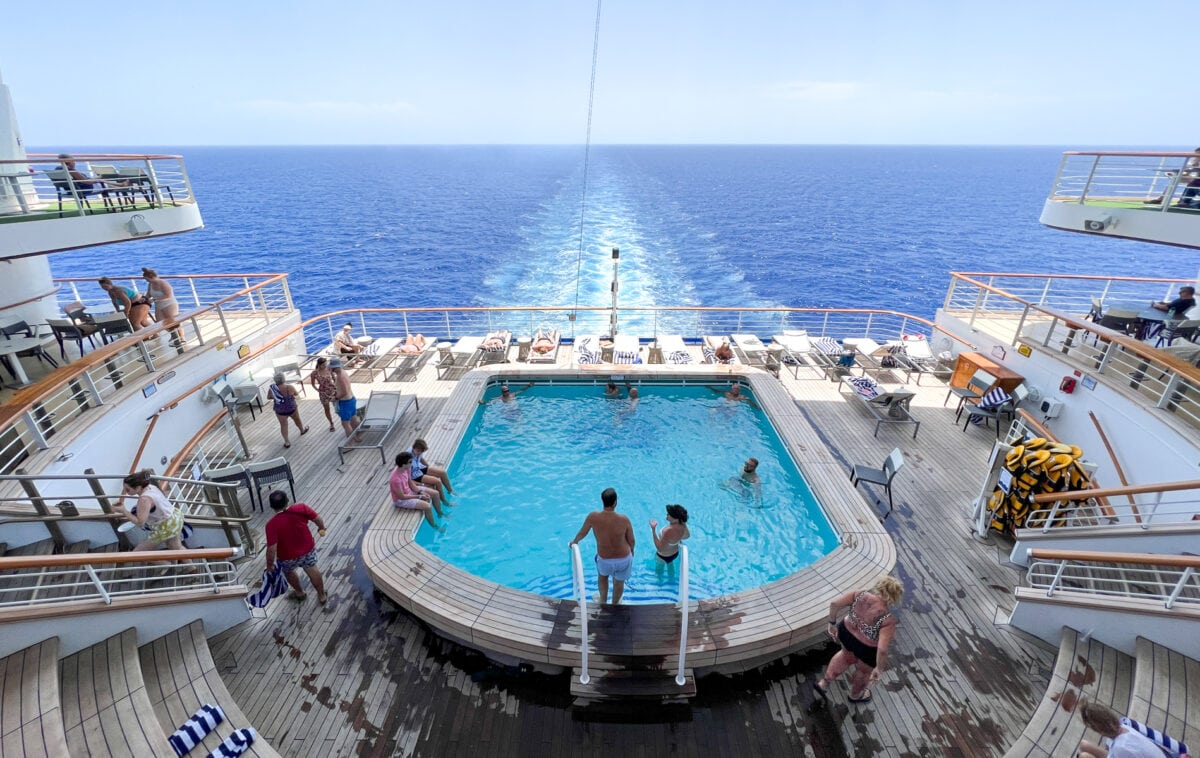 A couple swimming together in a Princess Cruises pool