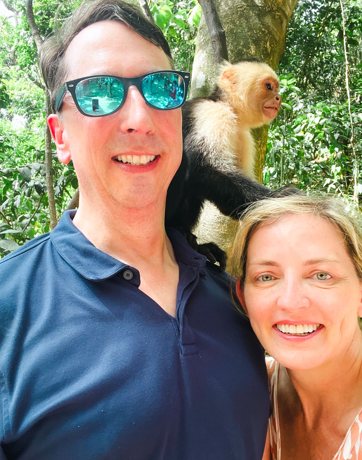 Couple with a capuchin monkey at Gumbalimba Park in Roatan, Honduras during a Princess Cruises shore excursion 