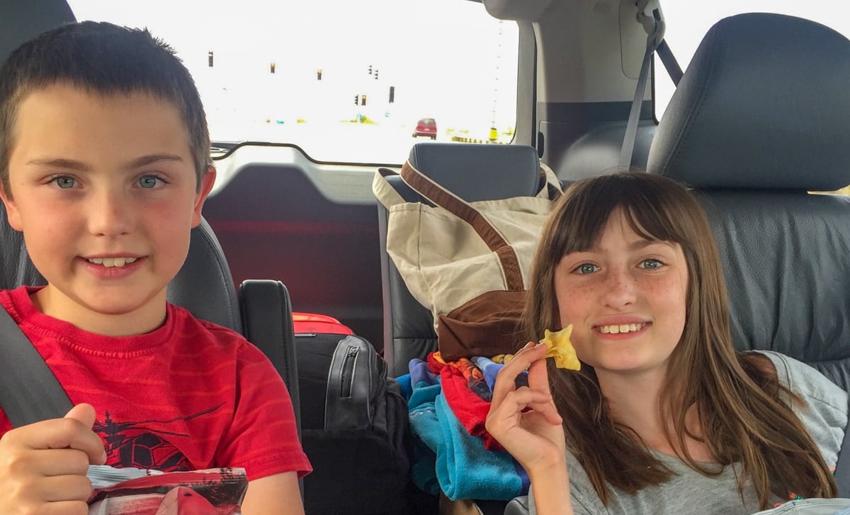Kids eating snacks in the car