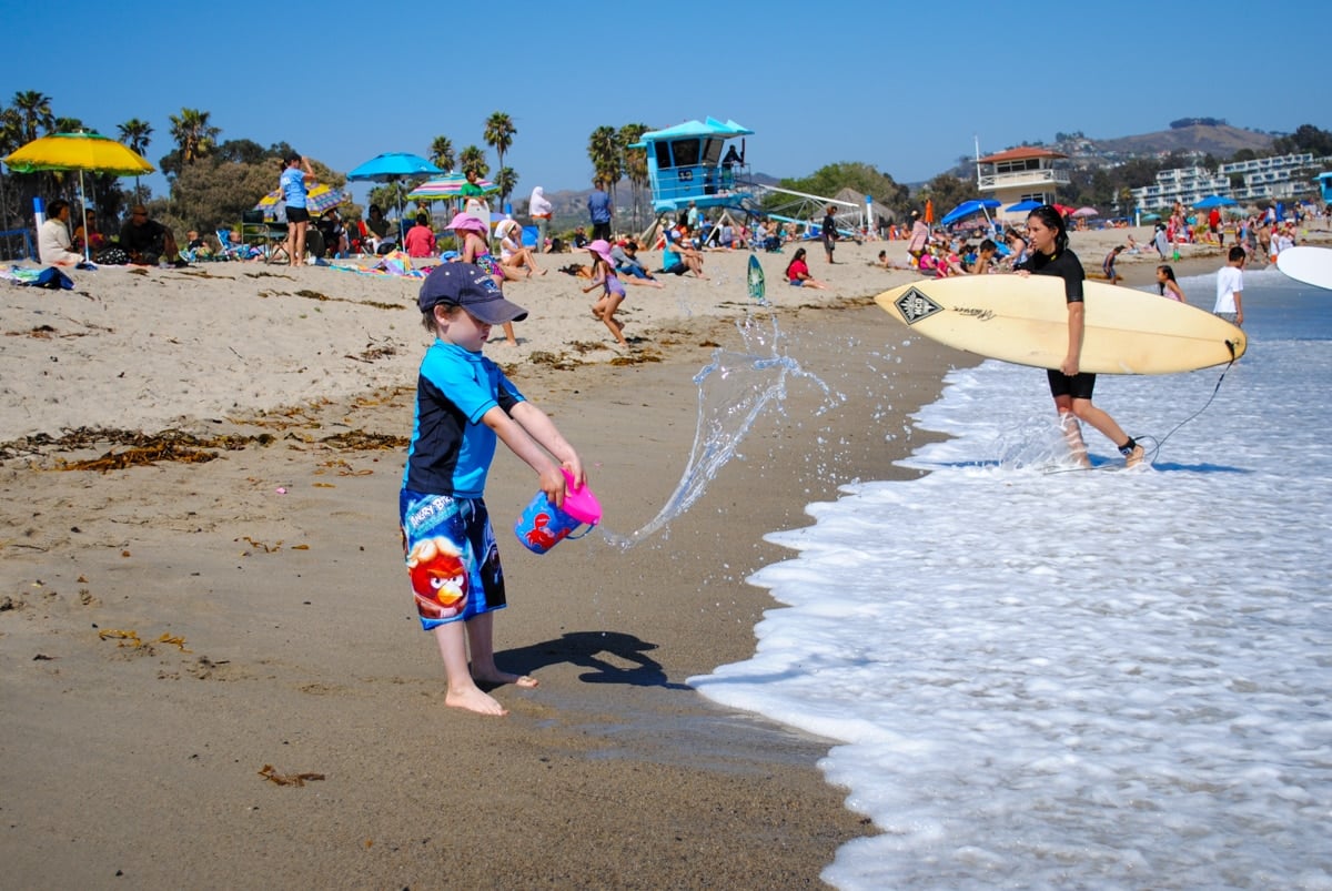Child playing in water at Doheny State Beach in Dana Point