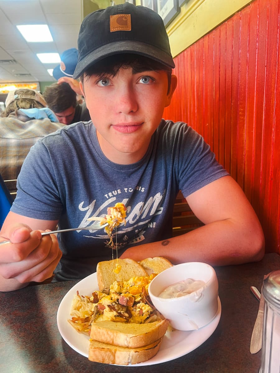 Teen eating a hearty breakfast at Yesterday's Soda Fountain & Pharmacy in Ennis