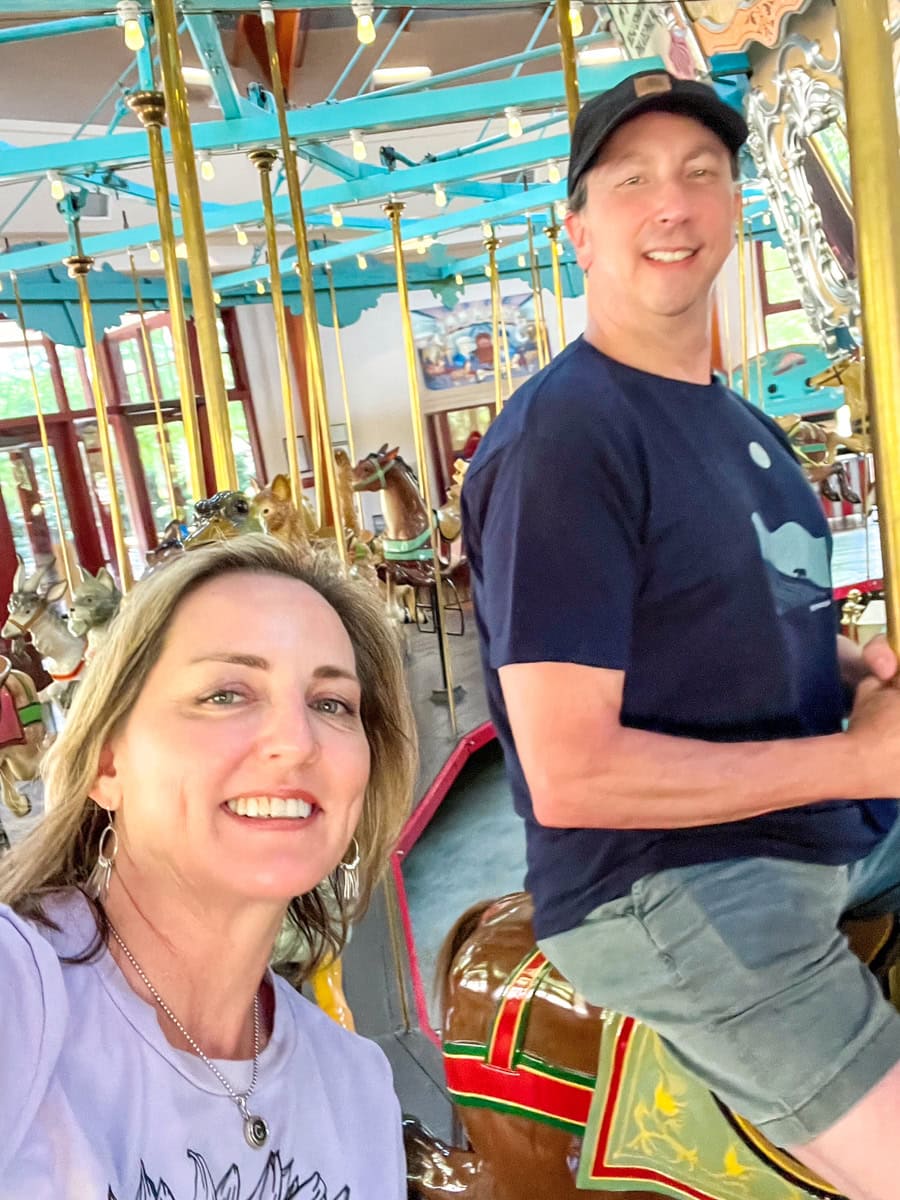 Romantic couple riding Pullen Park Carousel in Raleigh, NC