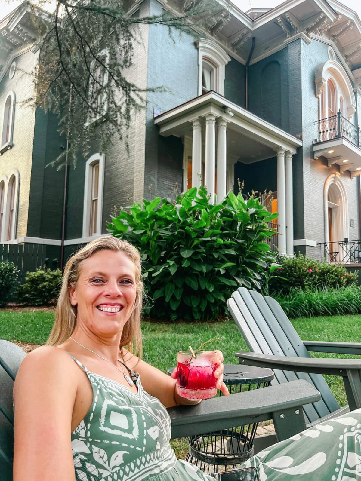 Caroline Makepeace sipping a cocktail at The Parlor at The Heights House Hotel